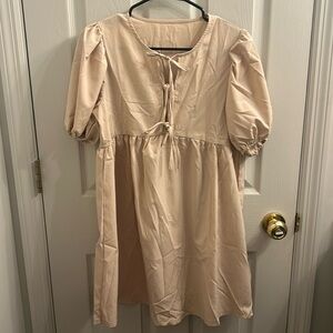 Cream/Tan colored puff sleeve, bowed dress